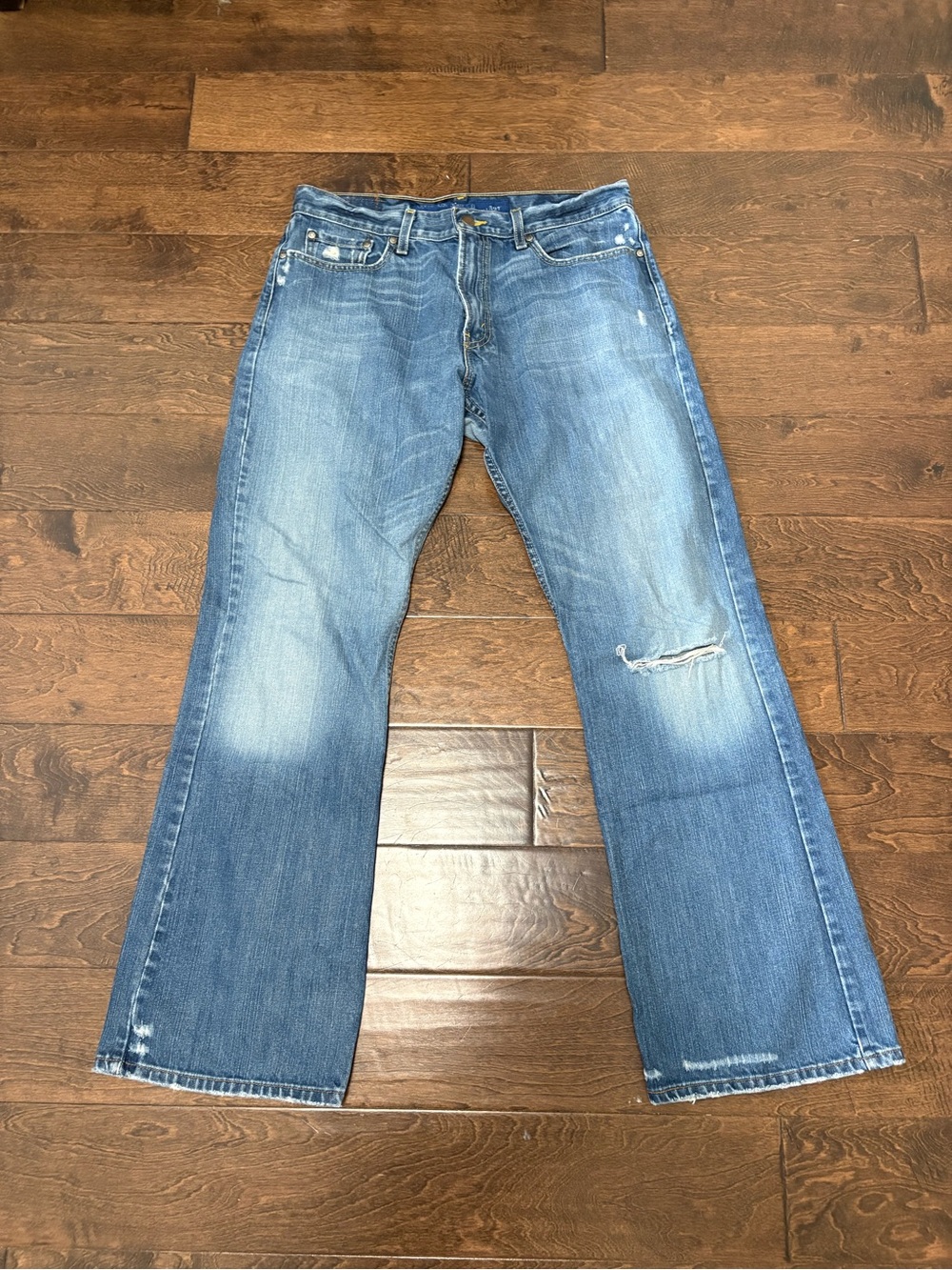 Levi's Men's Light Blue Bootcut Jeans with Distressed Detail